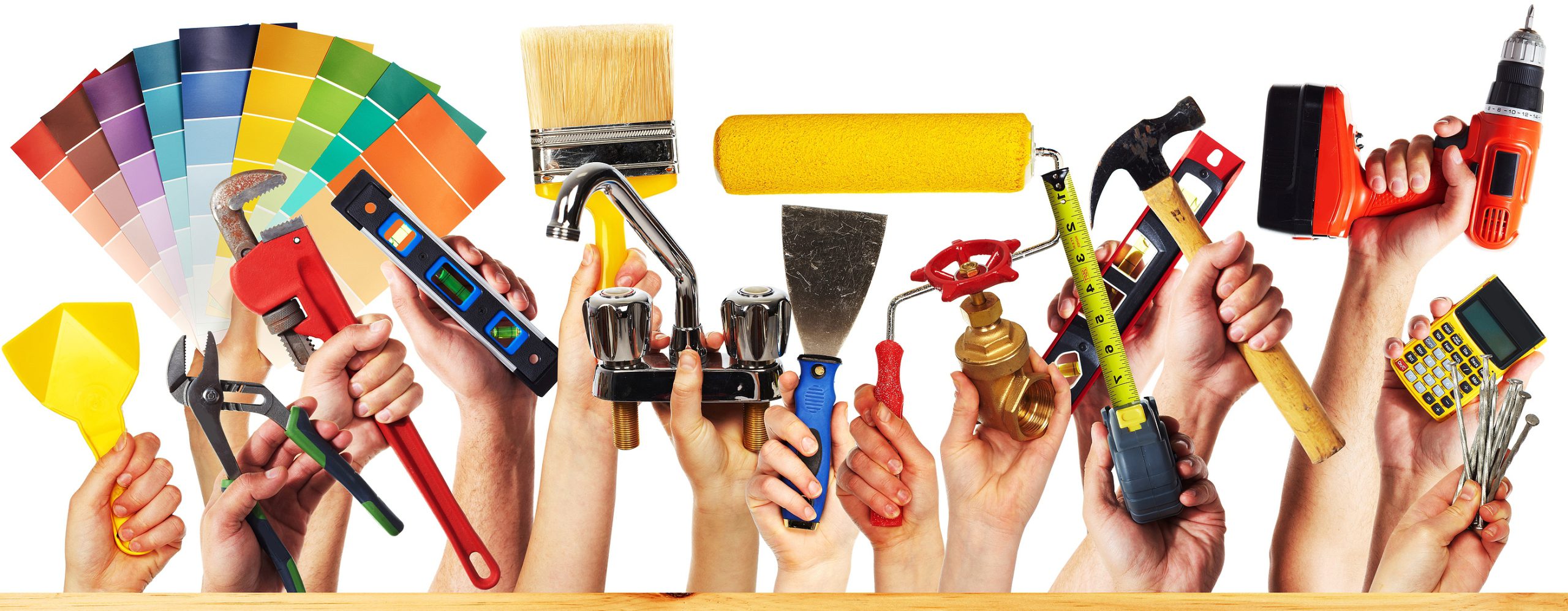 Hands with construction tools. House renovation background.